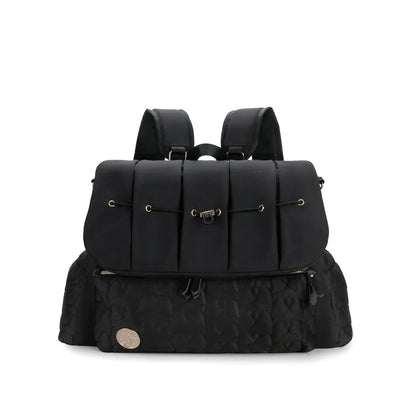 A black Cloudscape Diaper Backpack with organized storage and convertible design, shown from the front in a closed position, featuring a quilted bottom pocket.