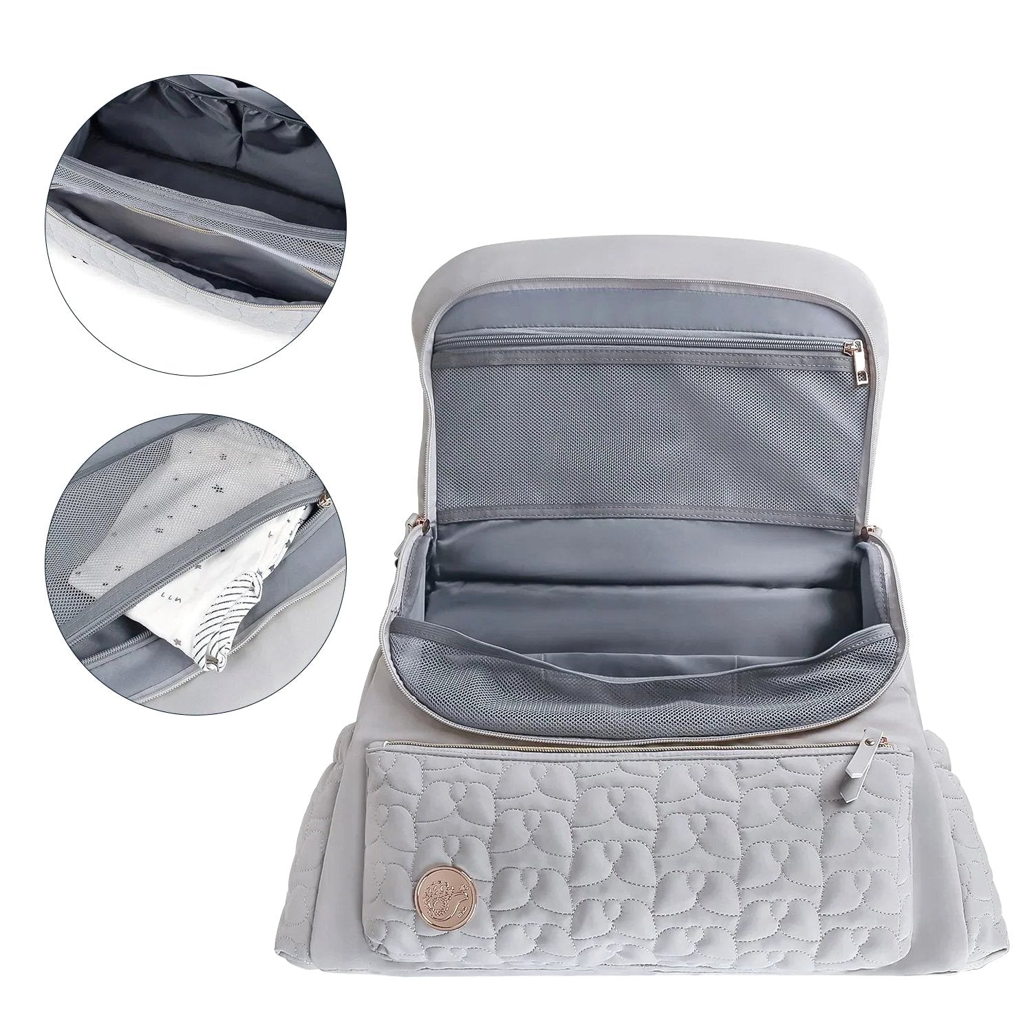 The gray Cloudscape Diaper Backpack open, showcasing its organized interior with mesh pockets. Inset images provide a closer look at a zippered pocket and a mesh pocket containing a baby outfit.