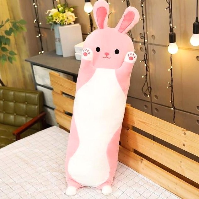 Cuddle Haven Pink Bunny Plush Toy, a long soft fabric stuffed animal with a huggable design, standing upright on a bed. Perfect as a cuddle buddy or kids gift. Measures 27 inches (70 cm).