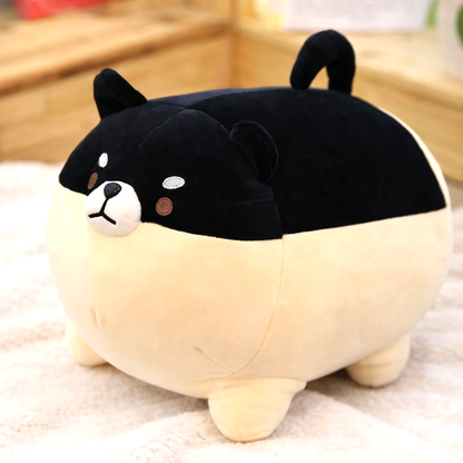 Black Shiba Inu plush toy with a cream belly, made from premium soft fabric, sitting on a light-colored carpet.