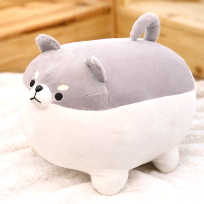 A single grey Shiba Inu plush toy, round and soft, sitting on a white textured surface. This adorable kawaii dog plush is made with premium soft fabric.