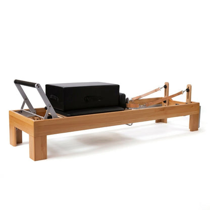 Peak Pilates Artistry Reformer with Leather three quarter view with box